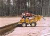 Trenching irrigation pipes on new field construction